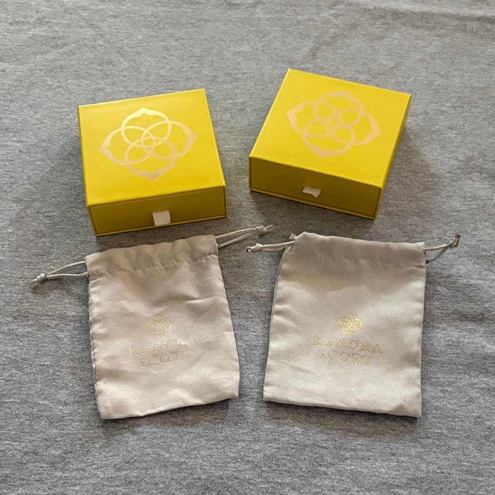 Kendra Scott Yellow Boxes and Cream Pouches